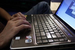 Guy Typing on a Laptop